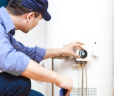 Plumber-repairing-an-hot-water